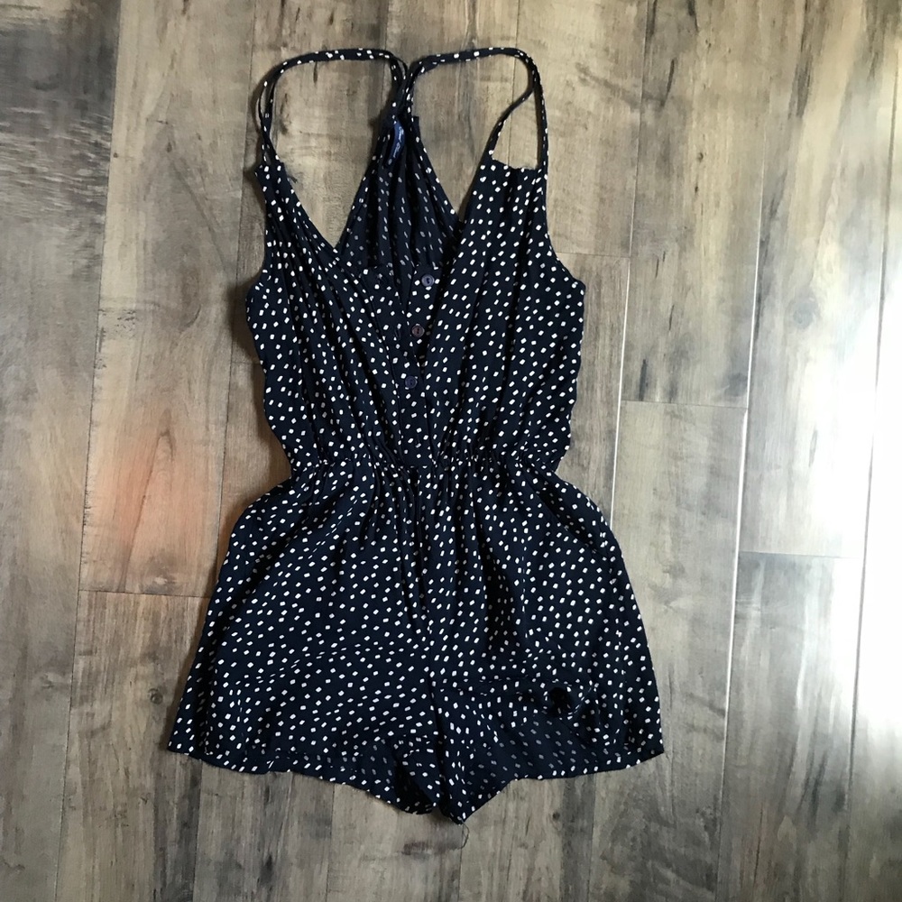 Francesca’s Navy polka dot romper Button front